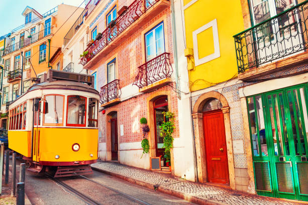 Yellow vintage tram on the street in Lisbon, Portugal. Famous travel destination